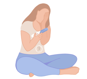 cómo se detecta la endometriosis mujer preocupada, con una mano a la cara, mirando un test de embarazo en la otra mano